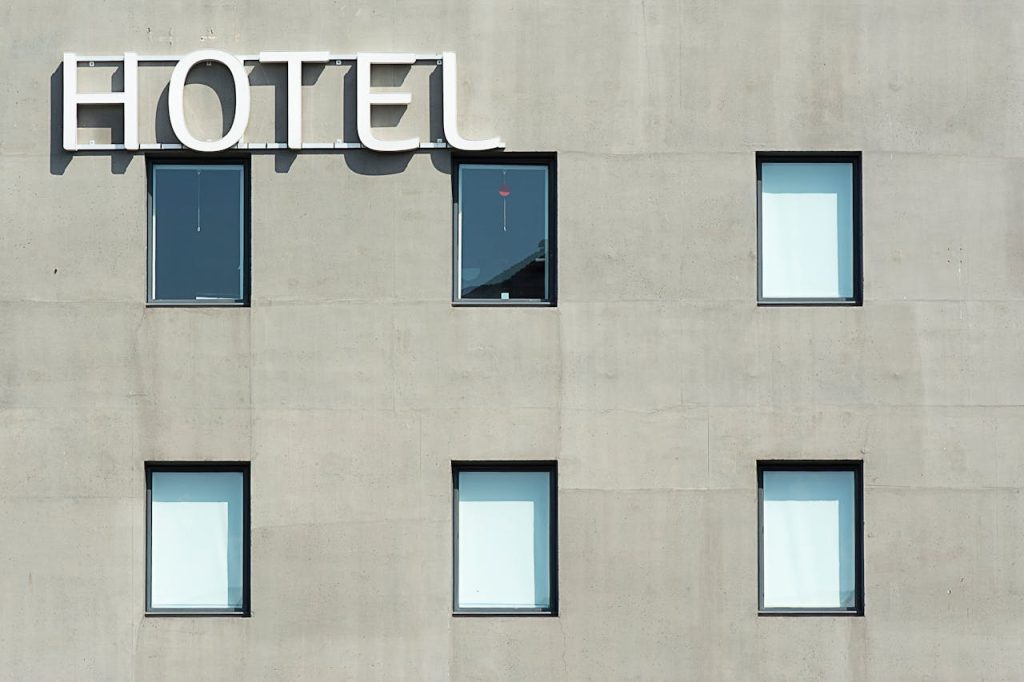 pexels photo 10047588 Contemporary hotel facade featuring minimalist design and geometric window patterns.