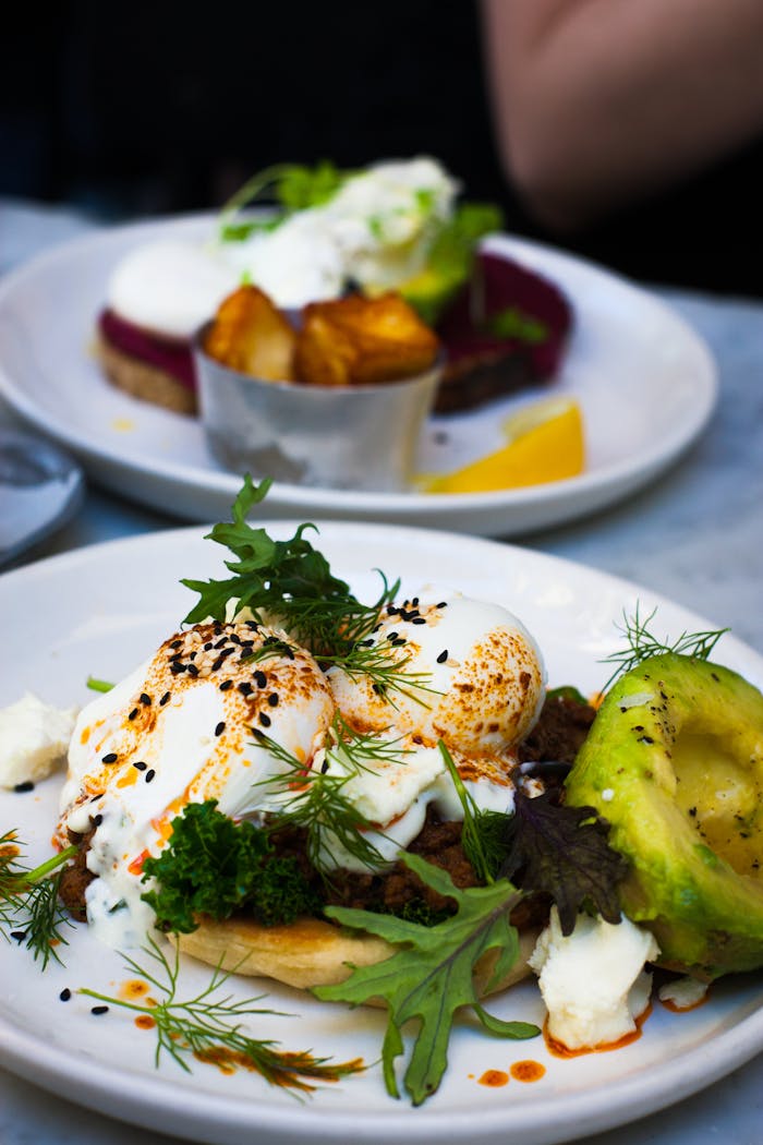 featured-portfolio-03 Delicious poached eggs served with avocado and fresh greens, perfect for a healthy gourmet brunch.